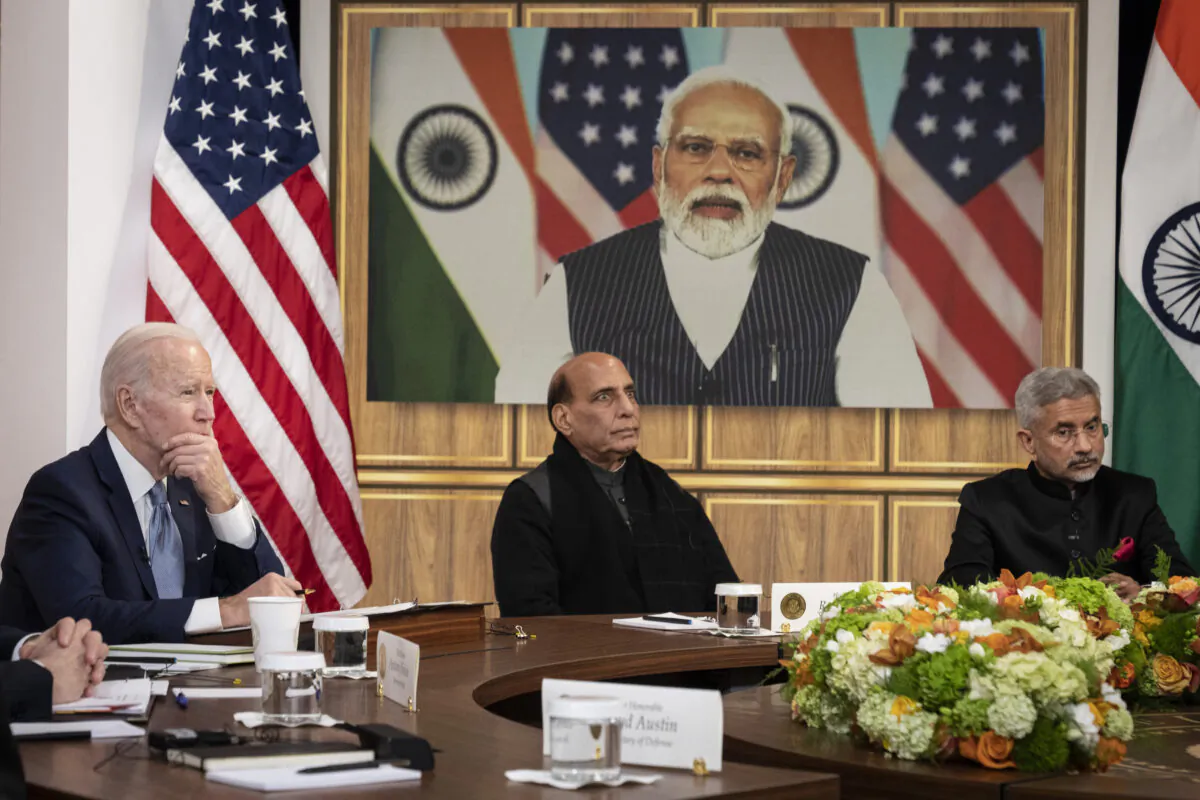 (L–R) U.S. President Joe Biden, Indian Minister of Defense Rajnath Singh, and Indian Foreign Minister Subrahmanyam Jaishankar listen as Prime Minister of India Narendra Modi (on screen) speaks during a virtual meeting in the South Court Auditorium of the White House complex on April 11, 2022. (Drew Angerer/Getty Images)