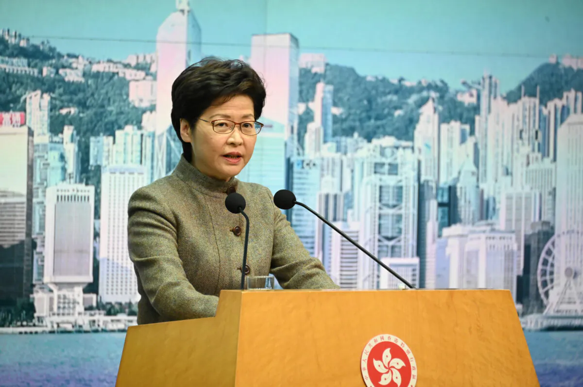 Hong Kong Chief Executive Carrie Lam speak during a press
conference in Hong Kong on Jan. 11, 2022. (Bill Cox/The Epoch Times)