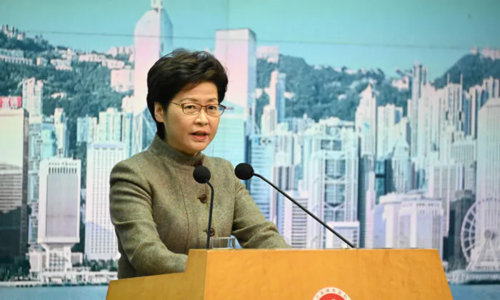 Hong Kong Chief Executive Carrie Lam speak during a press
conference in Hong Kong on Jan. 11, 2022. (Bill Cox/The Epoch Times)