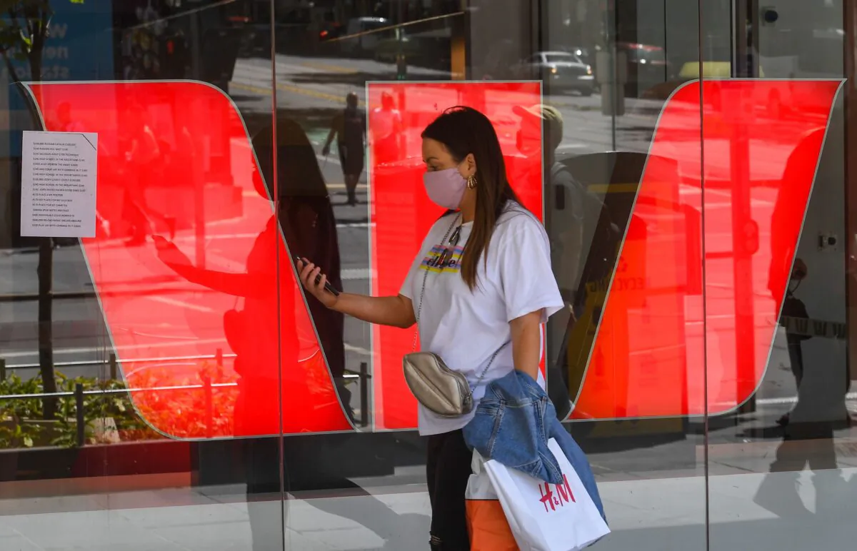 A woman walks past Westpac Bank signage in Melbourne, Australia, on Nov. 2, 2020.(William West/AFP via Getty Images)
