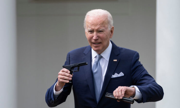 President Joe Biden holds up a so-called ghost gun kit during an event about gun violence in the Rose Garden of the White House on April 11, 2022. (Drew Angerer/Getty Images)