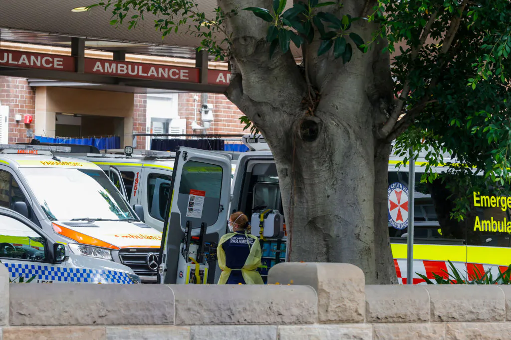 A paramedic unloads a patient from an ambulance at Royal Prince Alfred Hospital  in Sydney, Australia on January 10, 2022 . (Photo by Jenny Evans/Getty Images)