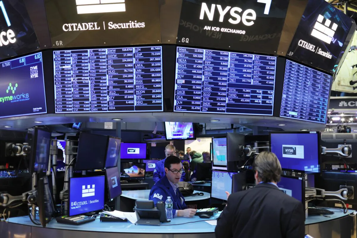 Traders work on the floor of the New York Stock Exchange in New York City on March 30, 2022. (Michael M. Santiago/Getty Images)