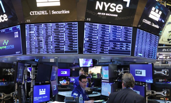 Traders work on the floor of the New York Stock Exchange in New York City on March 30, 2022. (Michael M. Santiago/Getty Images)