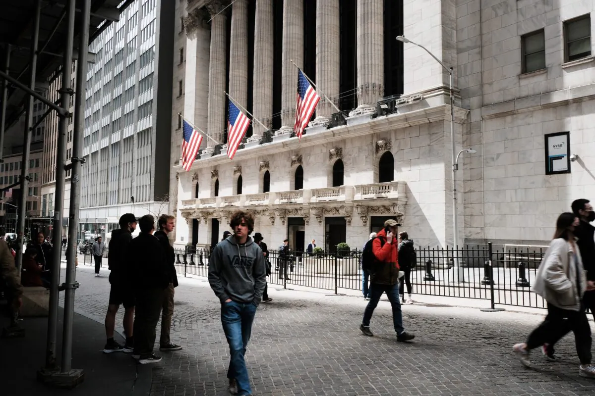 People walk by the New York Stock Exchange (NYSE) in New York City on April 4, 2022. (Spencer Platt/Getty Images)