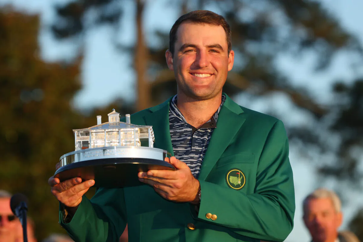 Scottie Scheffler poses with the Masters trophy during the Green Jacket Ceremony after winning the Masters at Augusta National Golf Club, in Augusta, Georgia, on April 10, 2022. (Andrew Redington/Getty Images)