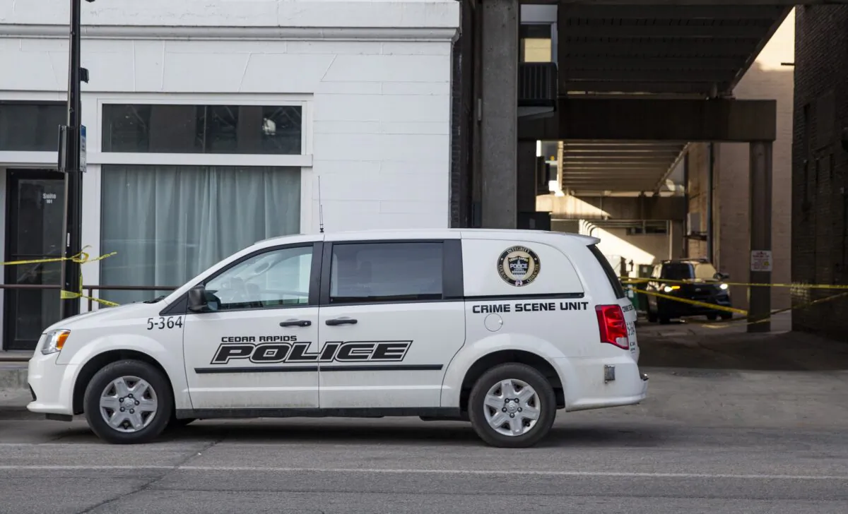 Police vehicles sit outside the Taboo Nightclub and Lounge in Cedar Rapids, Iowa, on April 10, 2022. (Savannah Blake/The Gazette via AP)