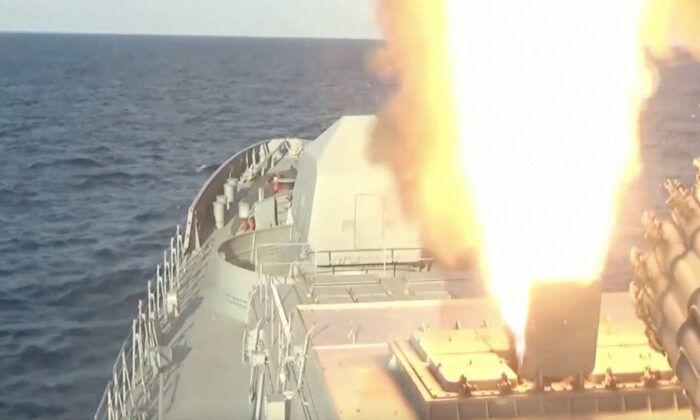 A Russian frigate launching Kalibr missiles from the Black Sea, in a still from video released by the Russian Defense Ministry on April 10, 2022. (Russian Defense Ministry via Reuters/Screenshot via The Epoch Times)