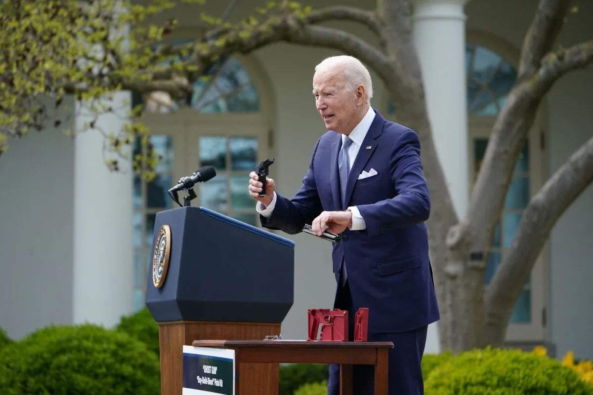 President Joe Biden holds up a ghost gun kit during an event at the White House in Washington on April 11, 2022. (Mandel Ngan/AFP via Getty Images)