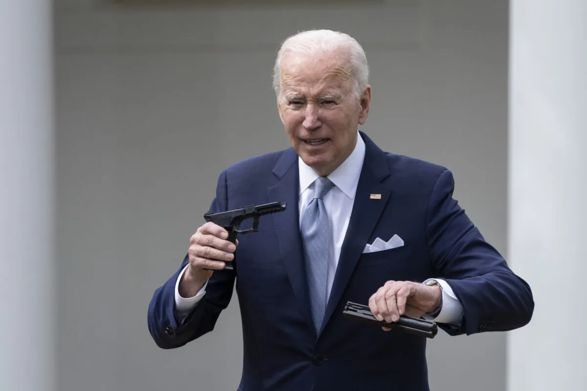 President Joe Biden holds up a so-called ghost gun kit during an event at the White House in Washington on April 11, 2022. (Drew Angerer/Getty Images)