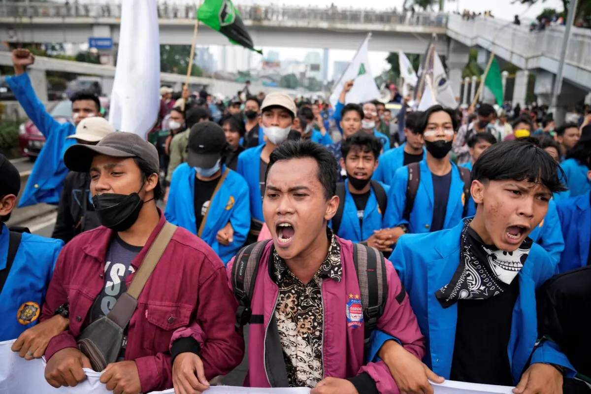 Students shout slogans during a rally outside the parliament in Jakarta, Indonesia, on April 11, 2022. (Dita Alangkara/AP Photo)
