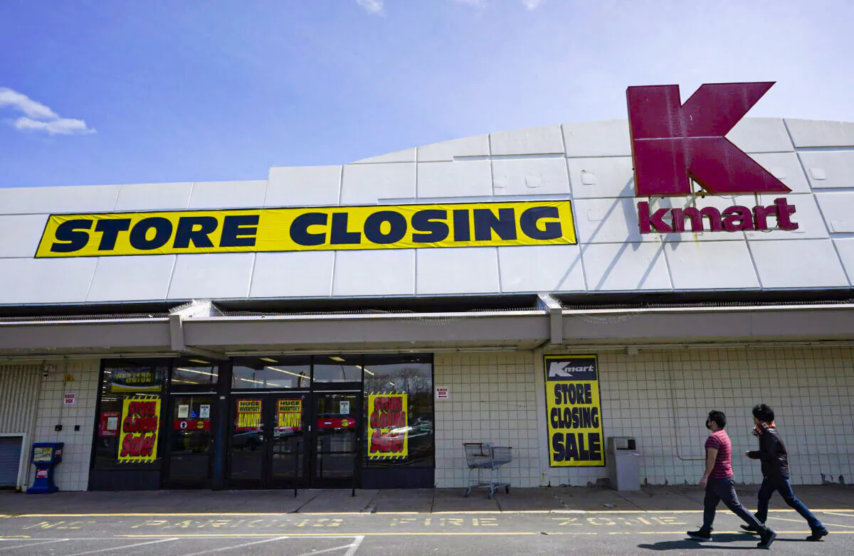 People walk into a Kmart in Avenel, N.J., on April 4, 2022. (Seth Wenig/AP Photo)