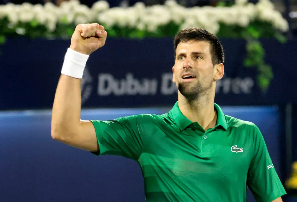 Novak Djokovic of Serbia celebrates after winning against Russian Karen Khachanov, during their ATP Dubai Duty Free Tennis match, in the Gulf emirate of Dubai, on Feb. 23, 2022. (Karim Sahib/AFP via Getty Images)