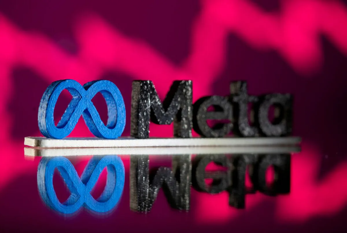 A 3D printed Facebook's new rebrand logo Meta in front of displayed stock graph in this illustration taken on Nov. 2, 2021. (Dado Ruvic/Illustration/Reuters)
