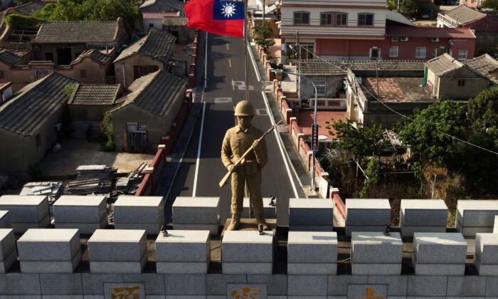 A military statue and Taiwanese flag atop  an arch built in remembrance of the Battle of Guningtou in 1949 at Taiwan's Kinmen islands on October 20, 2020. Kinmen islands lie just 3.2 kms (two miles) from the mainland China coast in the Taiwan Strait.(Sam Yeh/AFP via Getty Images)