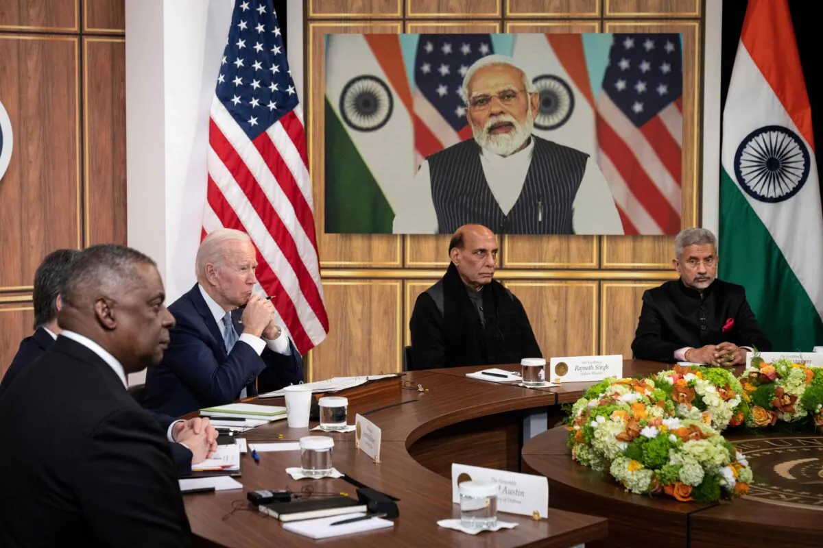 (L-R) U.S. Defense Secretary Lloyd Austin, U.S. President Joe Biden, Indian Minister of Defense Rajnath Singh, and Indian Foreign Minister Subrahmanyam Jaishankar listen as Prime Minister of India Narendra Modi (on screen) speaks during a virtual meeting in the South Court Auditorium of the White House complex in Washington on April 11, 2022. (Drew Angerer/Getty Images)