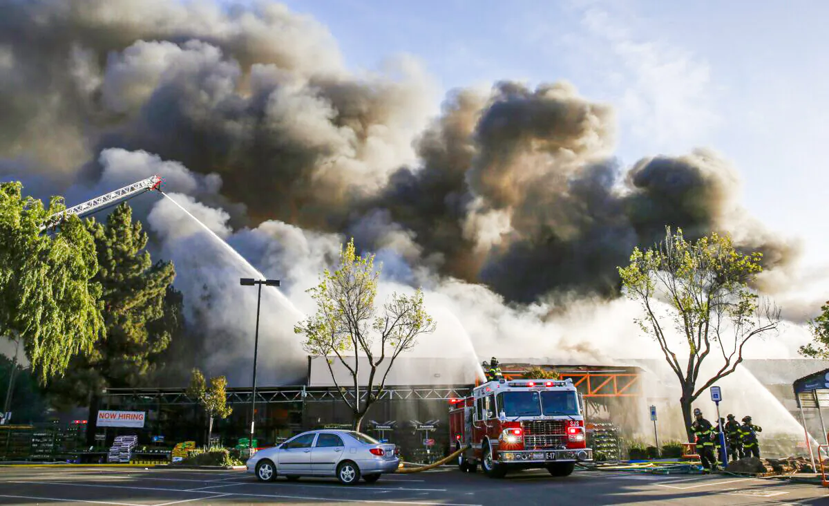 Firefighters work on a five-alarm fire at the Home Depot off Blossom Hill Road in San Jose, Calif., on April 9, 2022. (Shae Hammond/Bay Area News Group via AP)