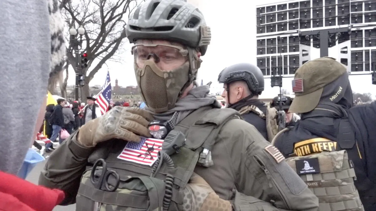 Oath Keepers member Jeremy Brown explains the group's constitution-focused mission to rallygoers in Washington on Jan. 6, 2021. The FBI unsuccessfully tried to recruit Brown to spy on the Oath Keepers. (Luke Coffee/Special to The Epoch Times)
