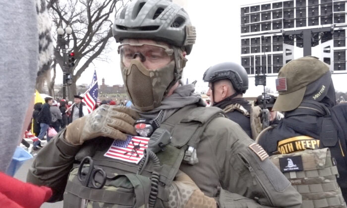 Oath Keepers member Jeremy Brown explains the group's constitution-focused mission to rallygoers in Washington on Jan. 6, 2021. The FBI unsuccessfully tried to recruit Brown to spy on the Oath Keepers. (Luke Coffee/Special to The Epoch Times)