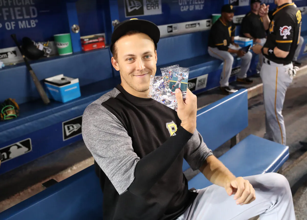 Jameson Taillon, No.50 of the Pittsburgh Pirates holds up selected Topps baseball cards on National Baseball Card Day before the start of MLB game action against the Toronto Blue Jays at Rogers Centre on August 12, 2017 in Toronto, Canada. (Tom Szczerbowski/Getty Images)