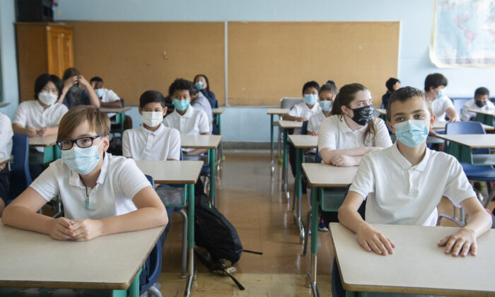 Students wear face masks as they attend class on the first day of school in Montreal on Aug. 31, 2021. (The Canadian Press/Graham Hughes)