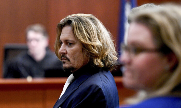 Actor Johnny Depp appears in the courtroom at the Fairfax County Circuit Court in Fairfax, Va., on April 12, 2022. (Brendan Smialowski, Pool via AP)