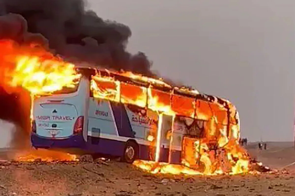 A tourist bus burns after it collided with a truck on a highway 43 kilometers (27 miles) south of the city of Aswan, southern Egypt, on April 13, 2022. (AP Photo)