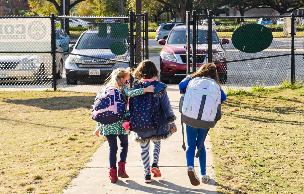 School children wearing masks walk outside Condit Elementary School in Bellaire, Texas, in Dec. 16, 2020. (Francois Picard/AFP via Getty Images)
