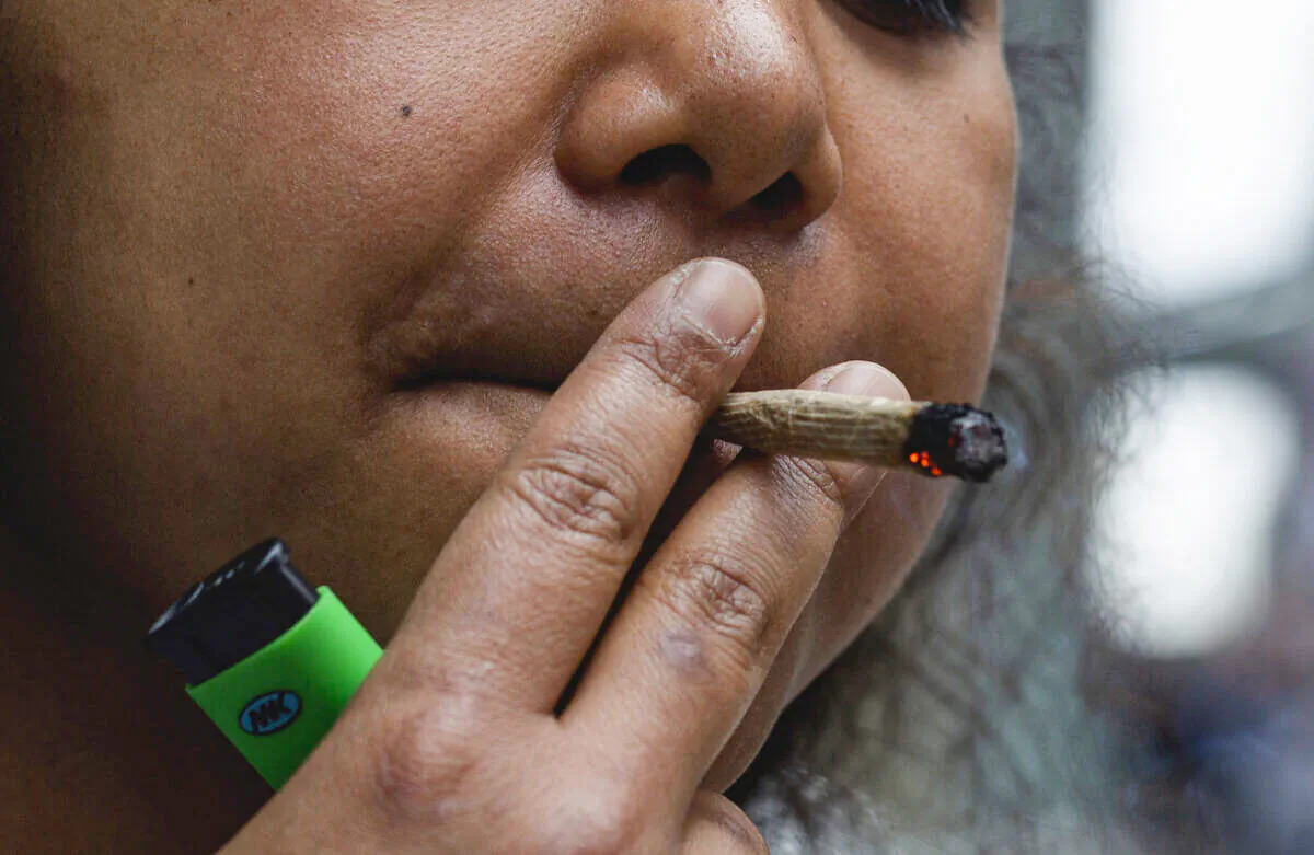 A woman smokes in New York City on March 31, 2021. (Kena Betancur/AFP via Getty Images)