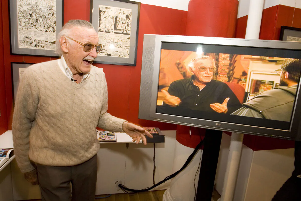 Comic book legend Stan Lee talks with guests at the opening reception for ''Stan Lee: A Retrospective'' presented by the Museum of Comic and Cartoon Art in New York City on Feb. 23, 2007. (Mat Szwajkos/Getty Images)
