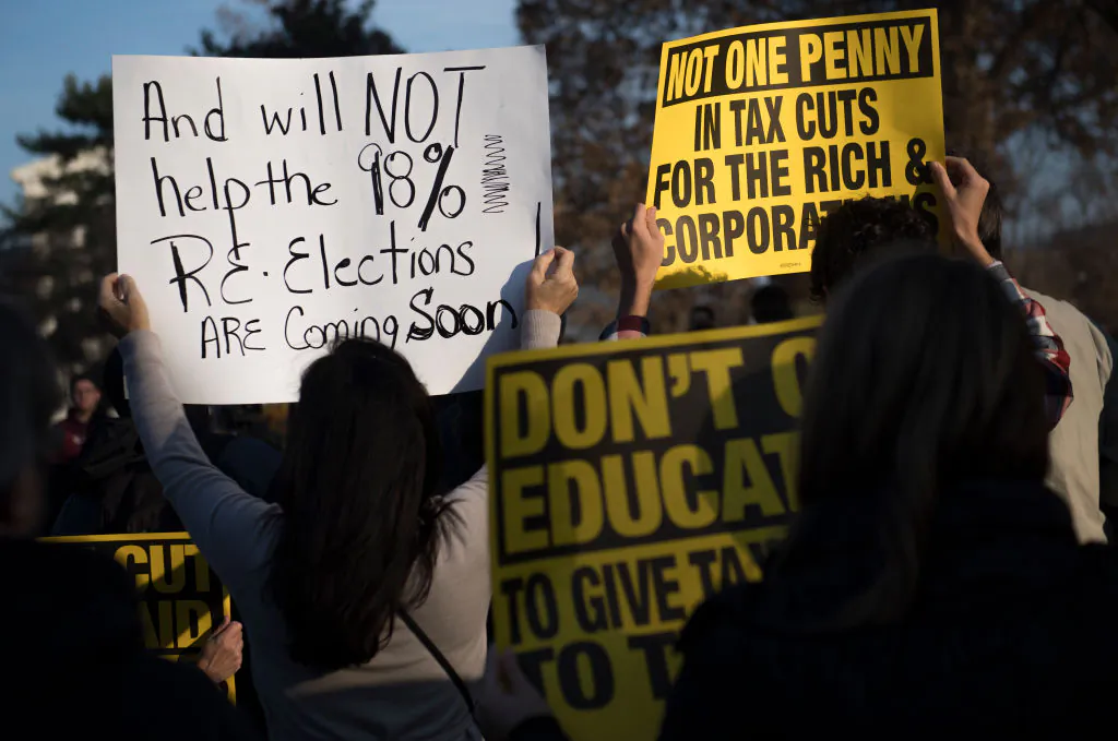 Demonstrators rally outside the U.S. Capitol on Capitol Hill in Washington, DC, on Nov. 30, 2017. (Saul Loeb/AFP via Getty Images)