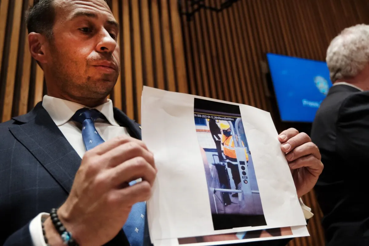 A picture of shooting suspect Frank James is held up during a New York City Police Department news conference in New York on April 13, 2022. (Spencer Platt/Getty Images)