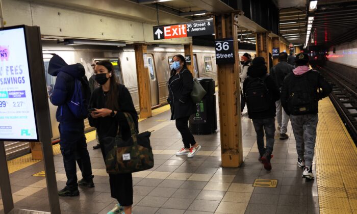 People wait for the train at the 36th Street subway station, where a shooting occurred the day prior, in New York City on April 13, 2022. (Michael M. Santiago/Getty Images)