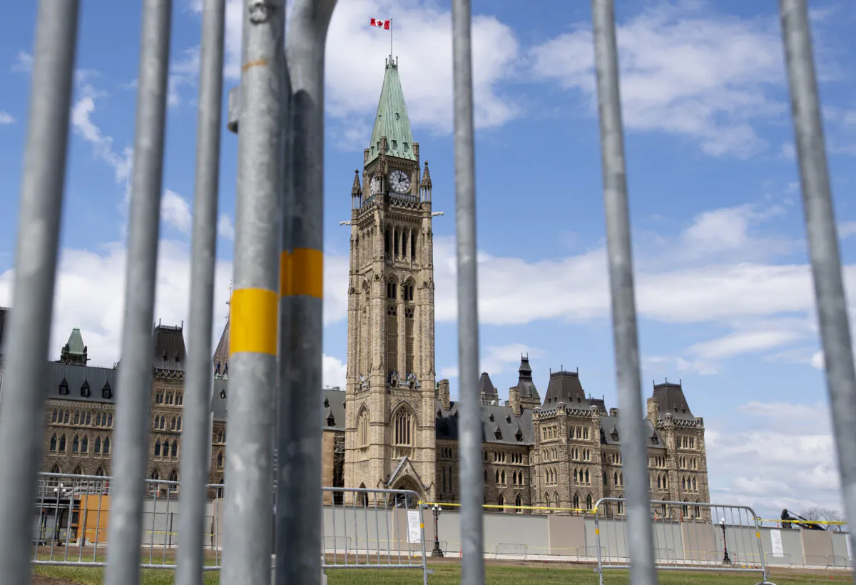 Temporary fences frame the Parliament buildings in Ottawa on June 30, 2020. (The Canadian Press/Adrian Wyld)