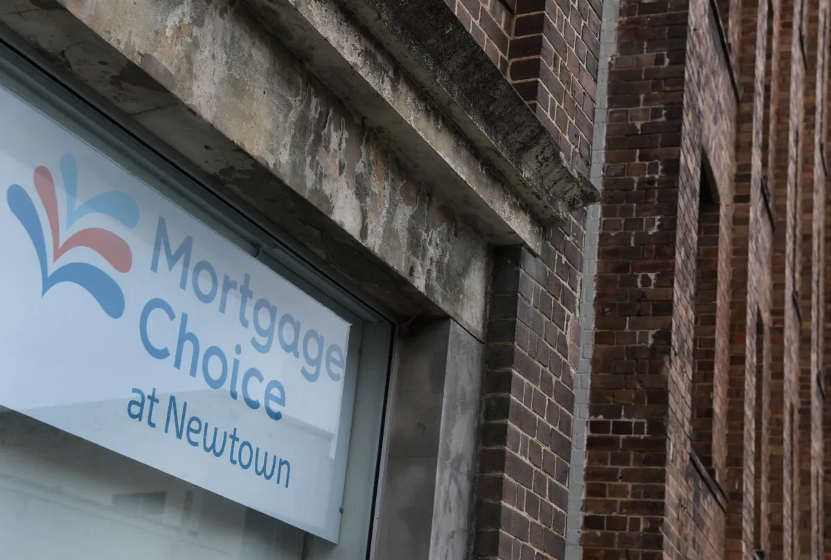 A sign for a mortgage adorns the side of a building in Sydney, Australia, on Dec. 6, 2016. (William West/AFP via Getty Images)