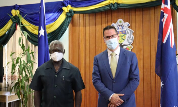 Solomon Islands Prime Minister Manasseh Sogavare (L) with Australian Pacific Minister Zed Seselja (R) in Honiara, Solomon Islands, on April 14, 2022. (Supplied/Australian Department of Foreign Affairs and Trade)