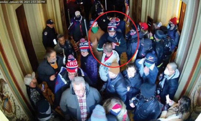 In an image from video, Dustin Thompson, circled, is spotted inside the U.S. Capitol on Jan. 6, 2021. (DOJ via The Epoch Times)
