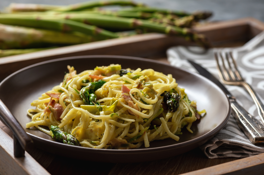 Asparagus—a natural match for bacon and eggs—adds seasonal flair to this comforting pasta dish. (Cesarz/Shutterstock)