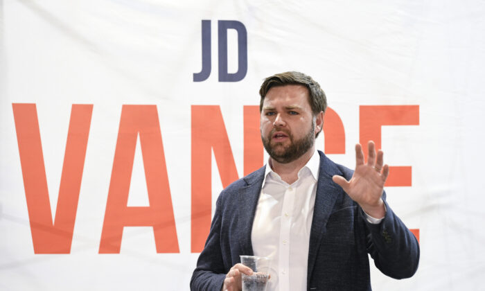 U.S. Senate candidate J.D. Vance speaks with prospective voters on the campaign trail in Troy, Ohio, on April 11, 2022. (Gaelen Morse/Getty Images)