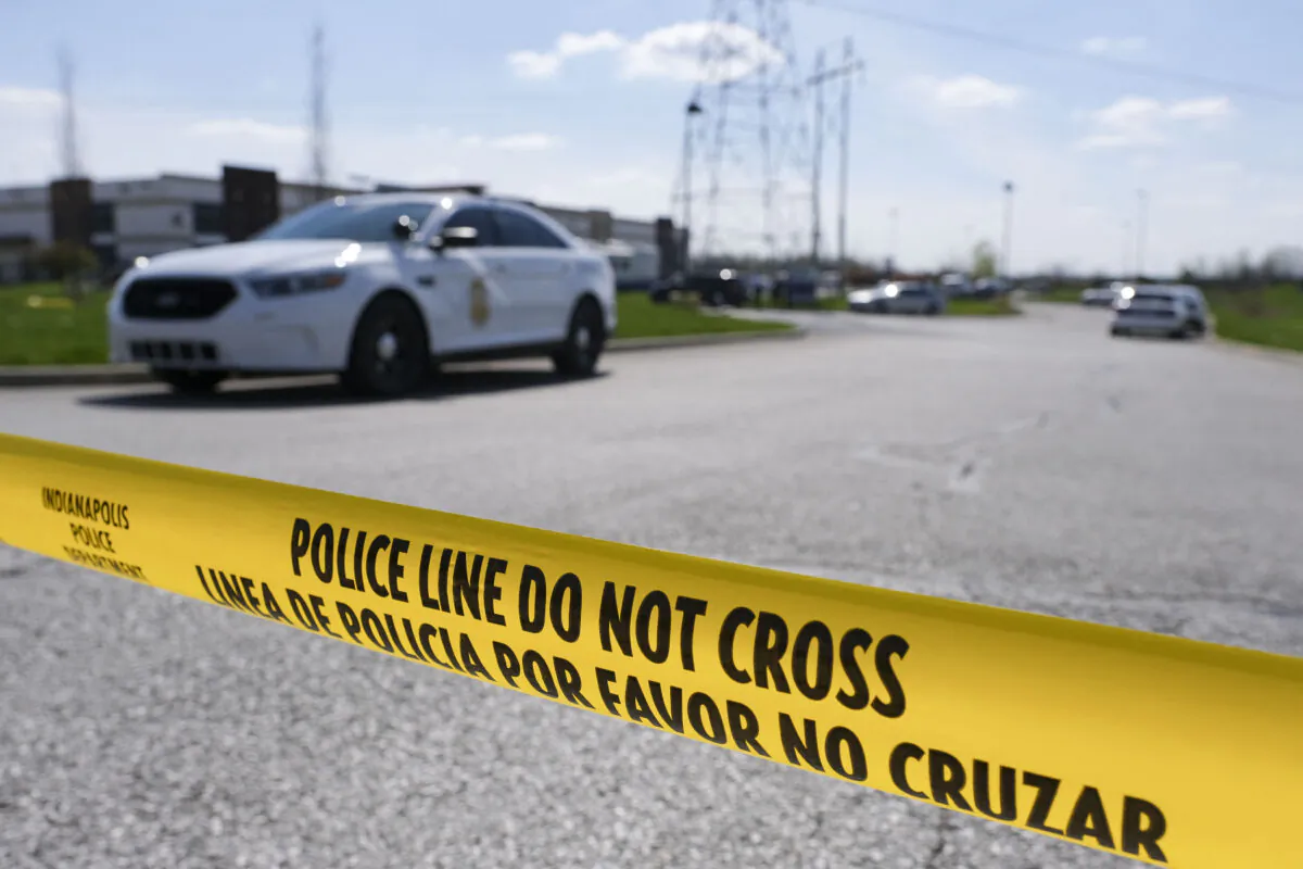Police caution tape blocks the entrance to a shooting  crime scene in a file photo (Jeff Dean/AFP via Getty Images)