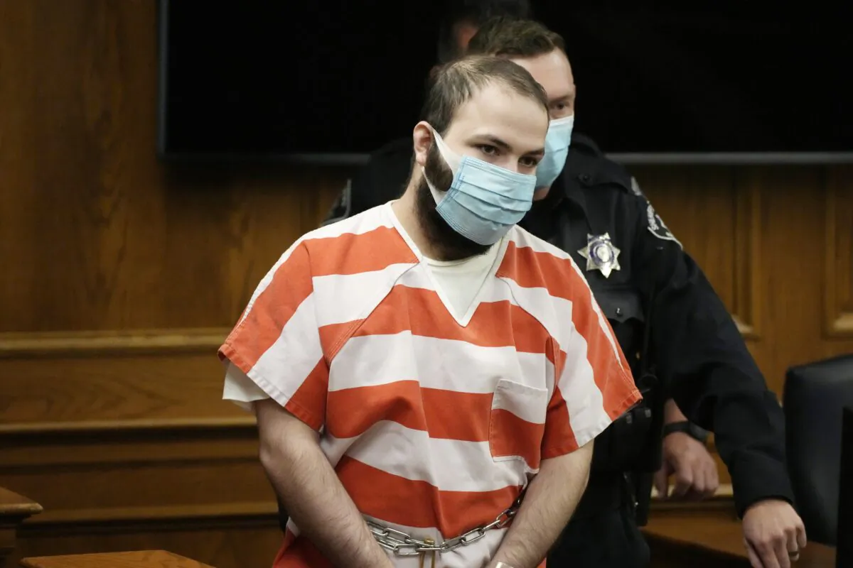 Ahmad Al Aliwi Alissa is led into a courtroom for a hearing in Boulder, Colo., on Sept. 7, 2021. (David Zalubowski/Pool/AP Photo)