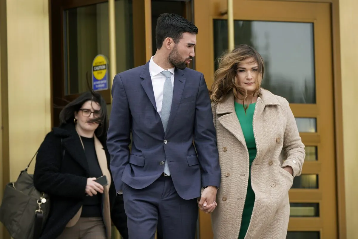 Democrat Abby Finkenauer leaves the Iowa Supreme Court Building with her husband Daniel Wasta in Des Moines, Iowa, on April 13, 2022. (Charlie Neibergall/AP Photo)