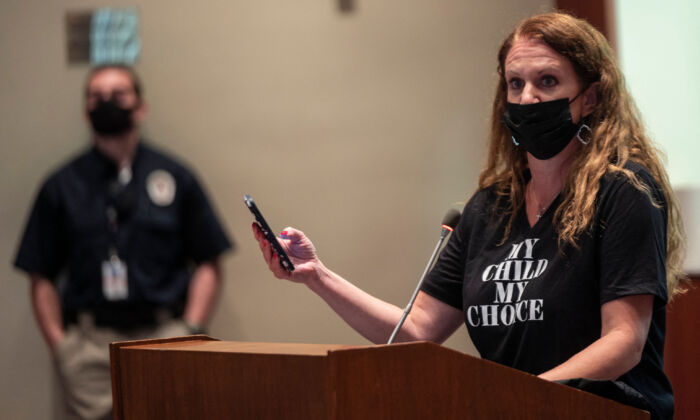 Patti Hidalgo Menders speaks out against board actions during a Loudoun County Public Schools board meeting in Ashburn, Virginia, on Oct. 12, 2021. (Andrew Caballero-Reynolds/AFP via Getty Images)