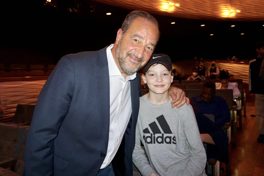Professor Francesco Plantania and his son at the Winspear Opera House in Dallas on April 15, 2022. (Yawen Hung/The Epoch Times)