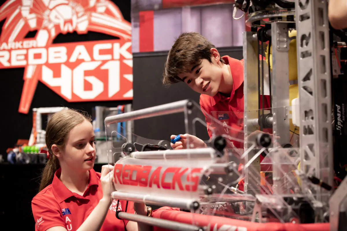 A supplied undated image shows year 12 students and team captains Suzanne Brian and Jack Wilson putting the final touches on the Redback's competition robot, obtained April 14, 2022. (AAP Image/Supplied by Barker College, Grant Leslie)