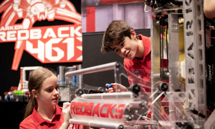 A supplied undated image shows year 12 students and team captains Suzanne Brian and Jack Wilson putting the final touches on the Redback's competition robot, obtained April 14, 2022. (AAP Image/Supplied by Barker College, Grant Leslie)