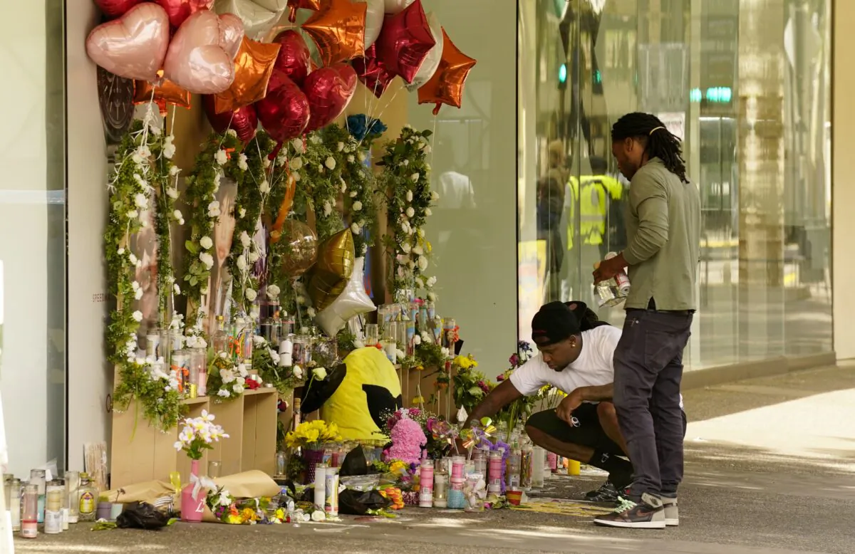 Mourners visit a memorial to victims of a recent mass shooting in Sacramento, Calif., on April 8, 2022. (Rich Pedroncelli/AP Photo)