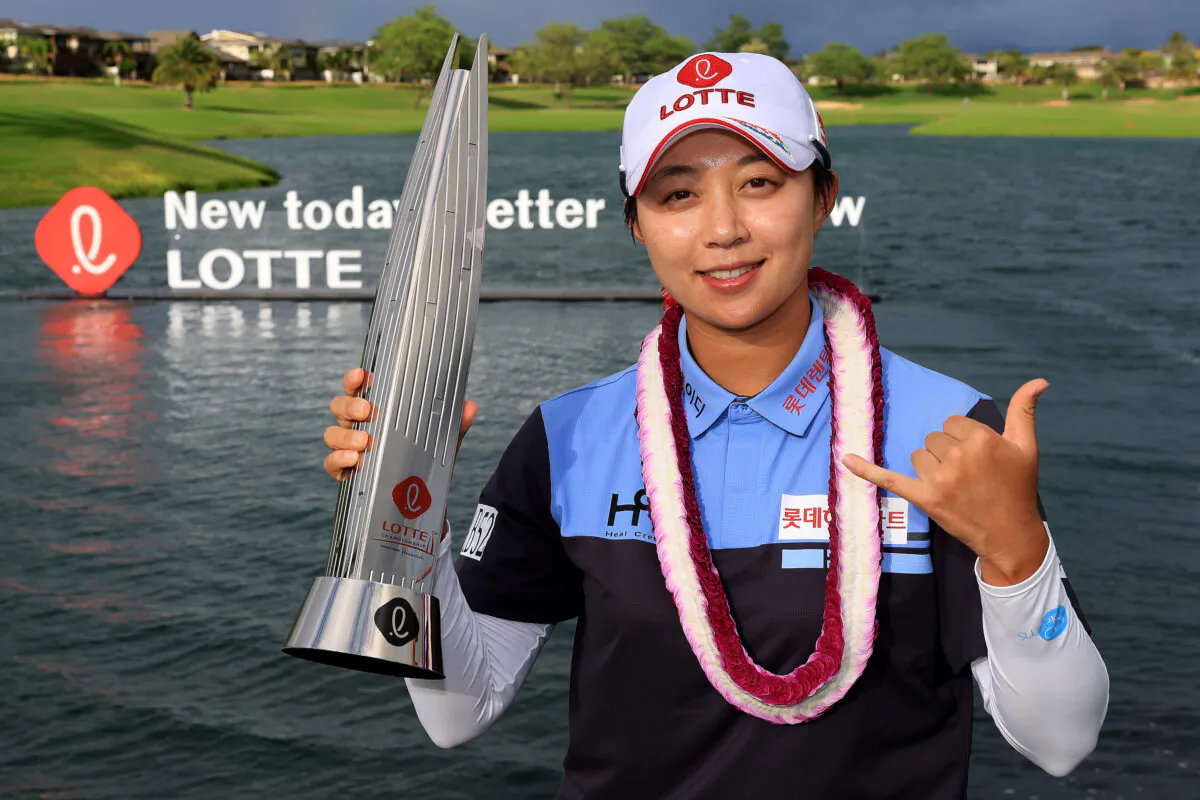 Hyo Joo Kim of The Republic of Korea poses with the Lotte Championship Trophy after winning the LOTTE Championship at Hoakalei Country Club, in Ewa Beach, Hawaii, on April 16, 2022. (Sean M. Haffey/Getty Images)