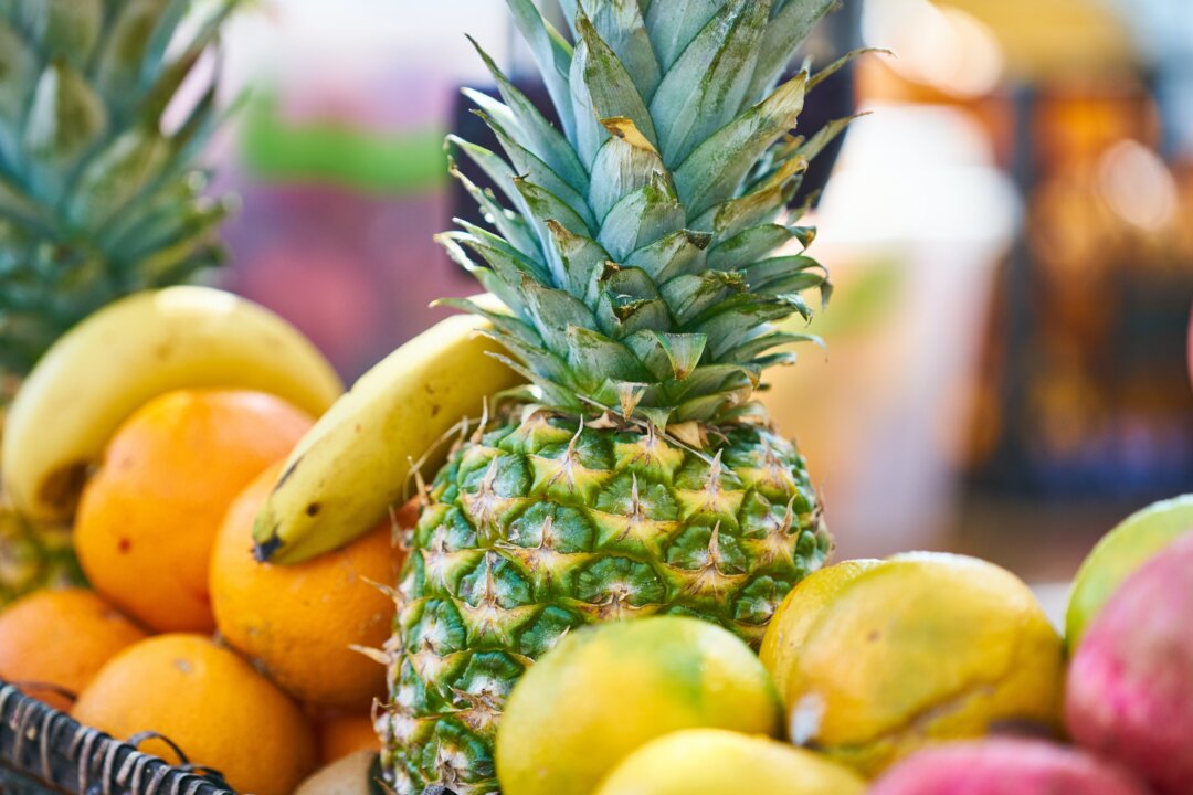 Digestive enzymes are produced in the body, and they are also found in unprocessed, raw foods such as bromelain (in pineapple) and papain (papaya). (Photo by Engin Akyurt/Pexels)