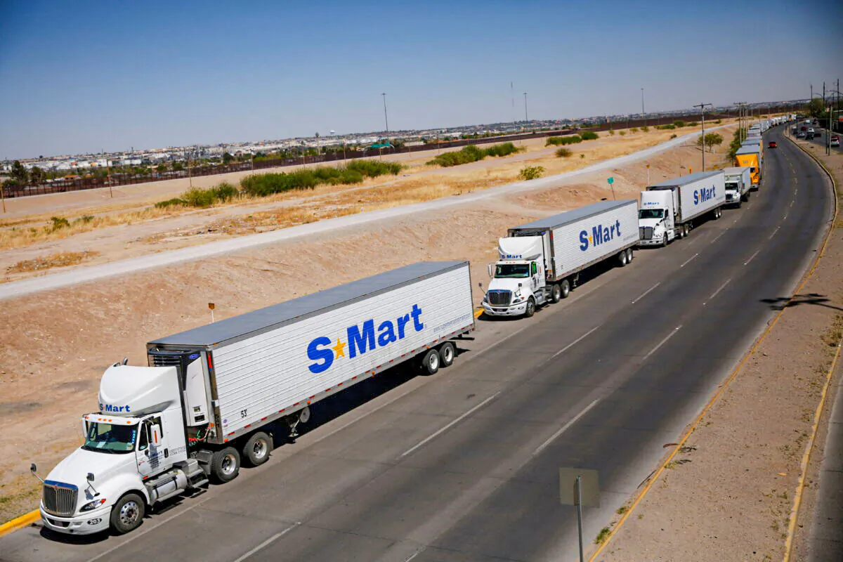 Trucks wait in a queue to cross into the United States near in the Cordova of the Americas International border bridge connecting the city of Ciudad Juarez to El Paso, Texas, in Ciudad Juarez, Mexico, on April 13, 2022. (Jose Luis Gonzalez/Reuters)